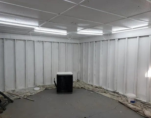 a view of a room with a wooden wall