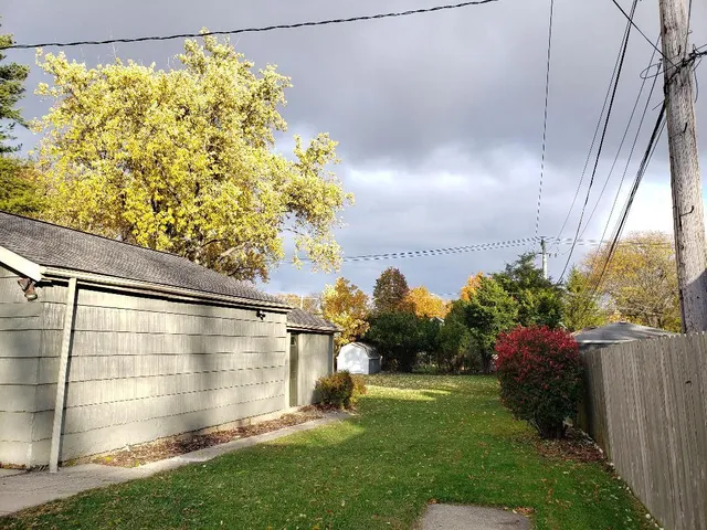 a view of a back yard from a balcony
