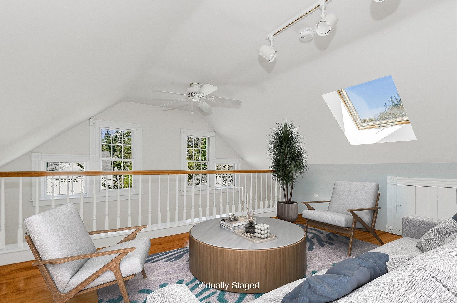 1089 Main Street Cotuit, MA 02635 - Photo 18 of 41 a living room with furniture and a table