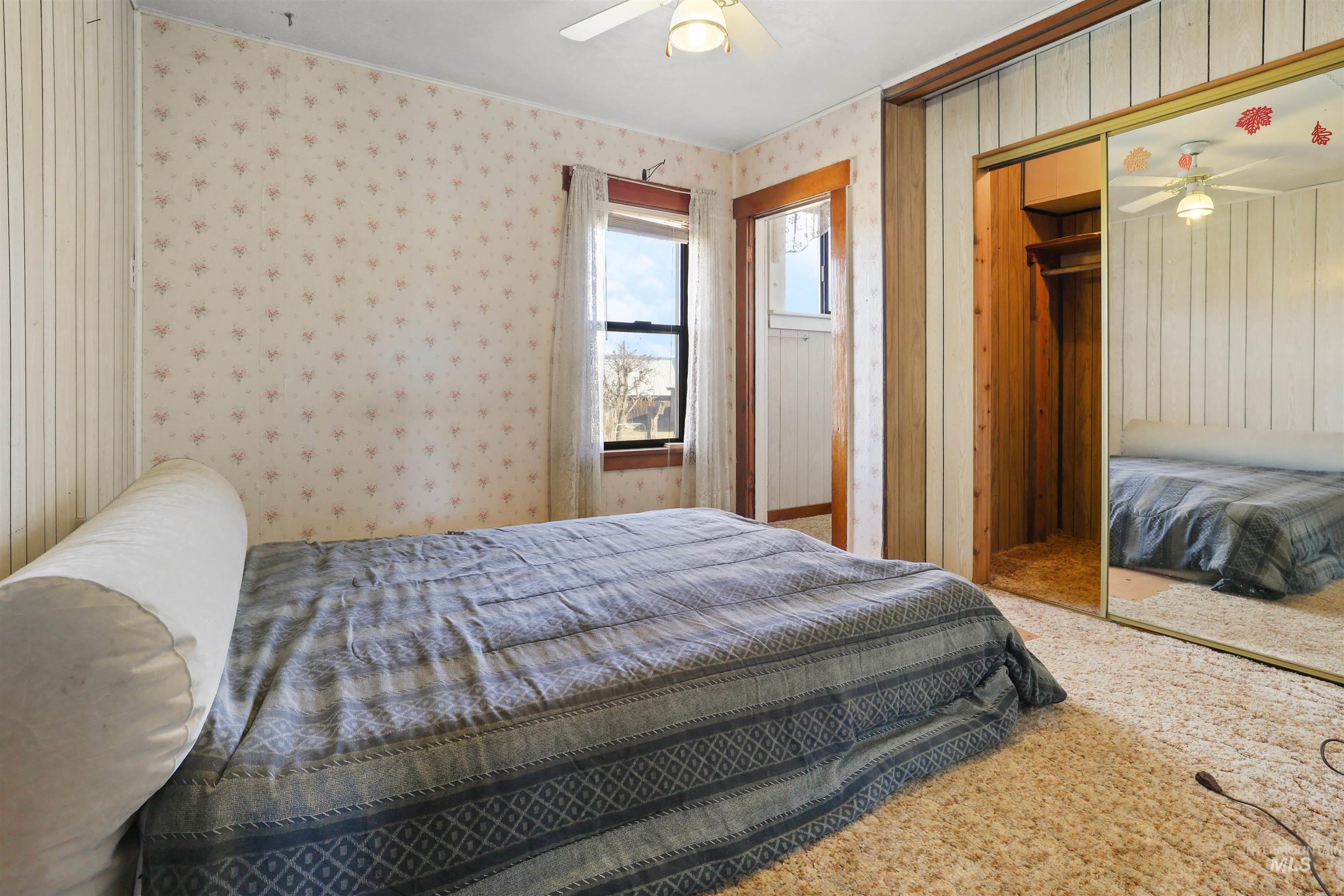 216 Ulmer Road Kooskia, ID 83539 - Photo 19 of 49 Bedroom featuring a closet, carpet flooring, and ceiling fan