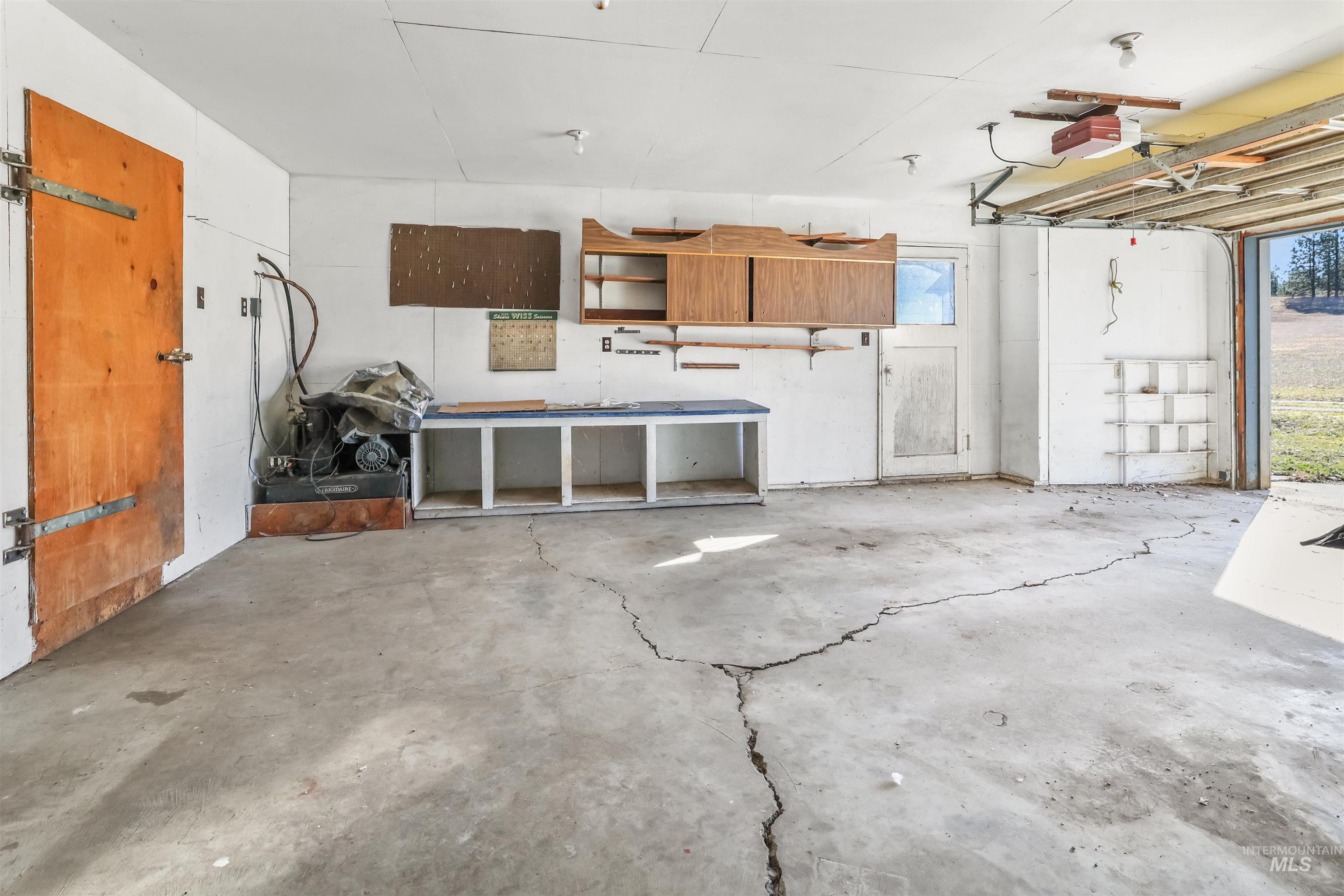 216 Ulmer Road Kooskia, ID 83539 - Photo 30 of 48 Garage with a garage door opener