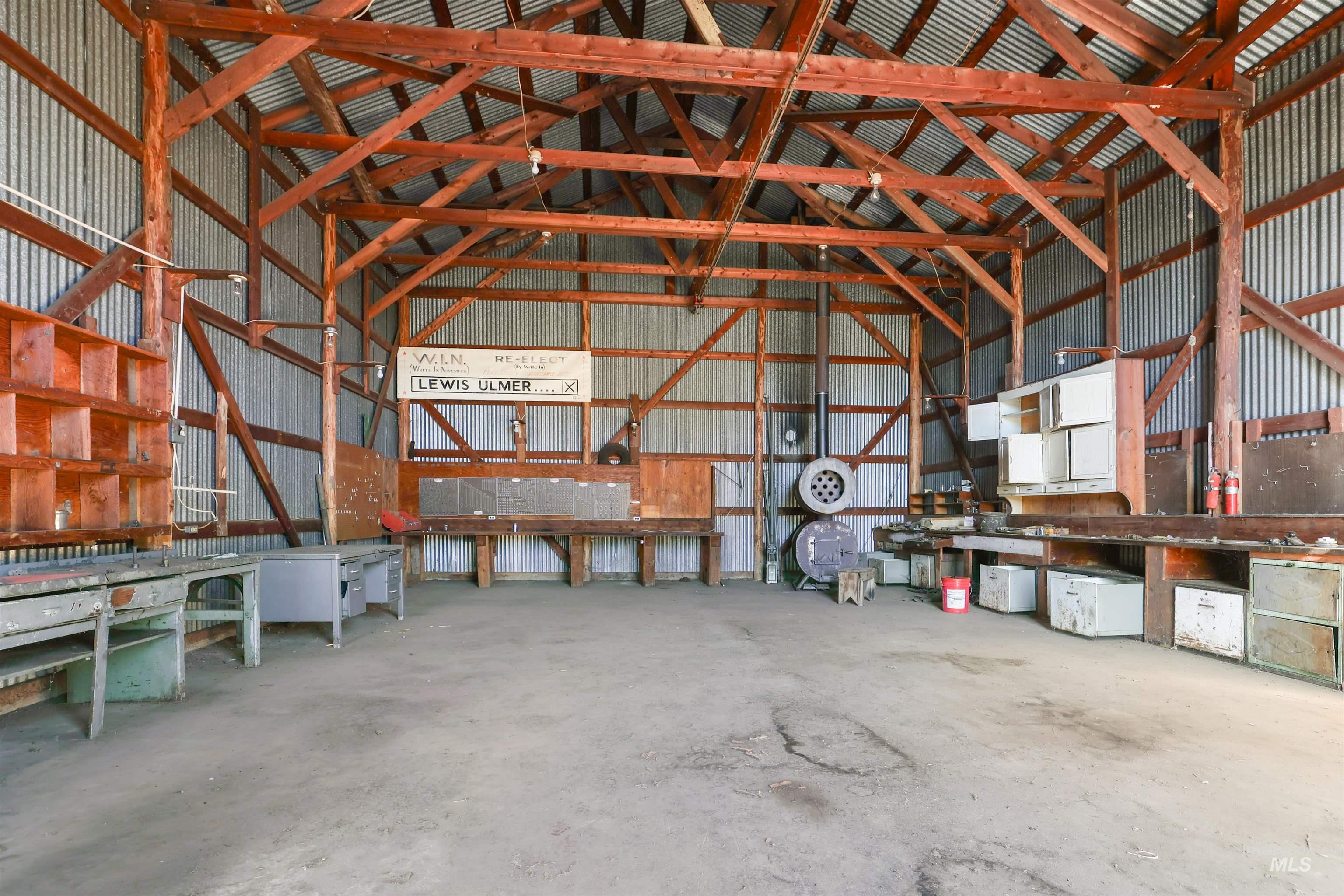 216 Ulmer Road Kooskia, ID 83539 - Photo 40 of 48 Garage featuring metal wall and a workshop area