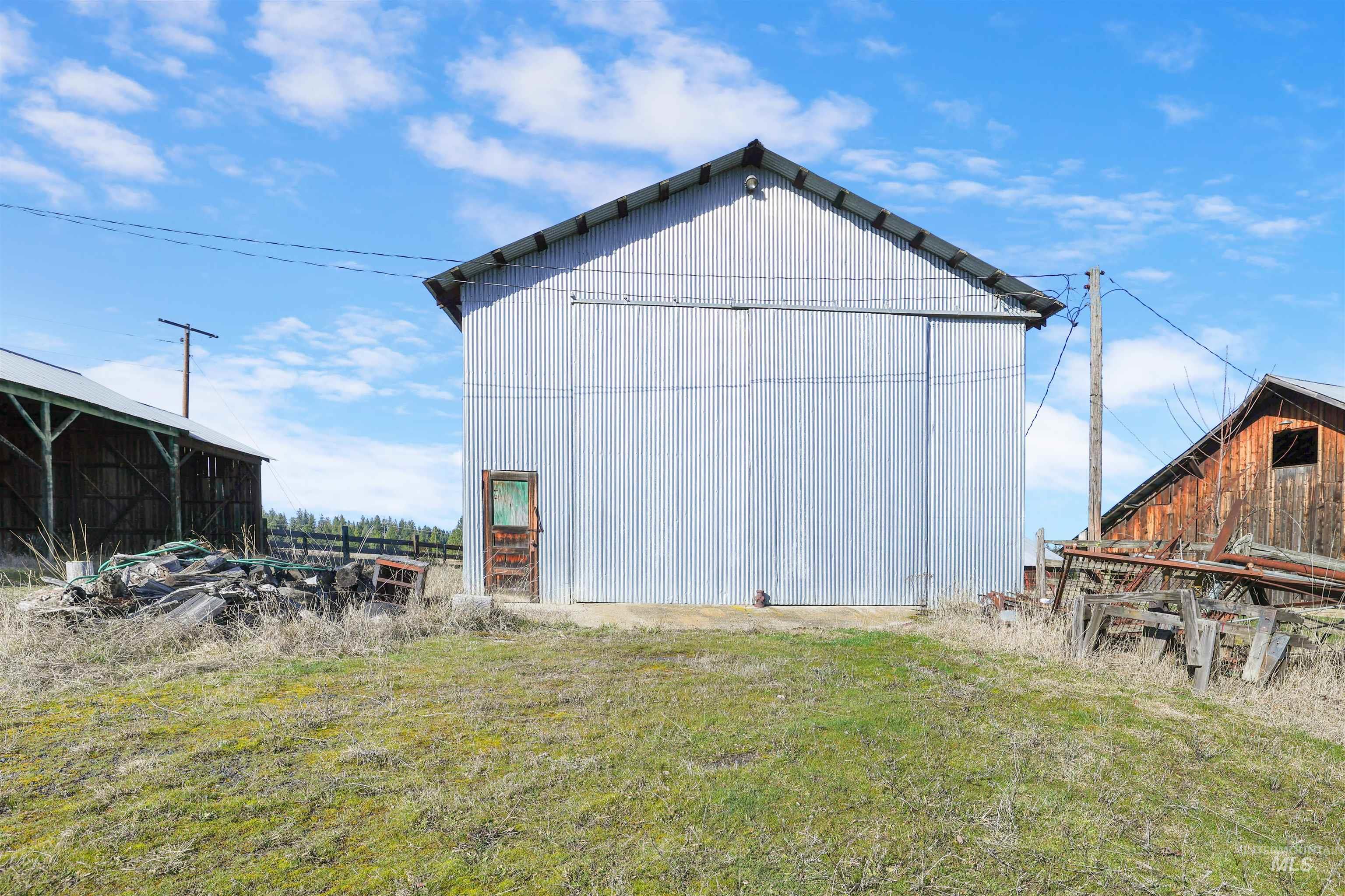 216 Ulmer Road Kooskia, ID 83539 - Photo 42 of 48 View of pole building featuring a lawn