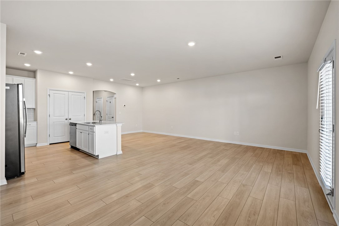452 Bee Cv Way Pendleton, SC 29670 - Photo 11 of 37 This expansive space features an open layout with rich wood flooring and abundant recessed lighting.
