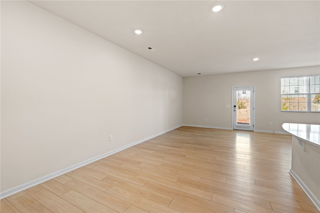 452 Bee Cv Way Pendleton, SC 29670 - Photo 12 of 37 Bright and airy open concept living area with durable wood flooring.