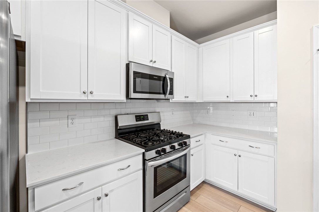 452 Bee Cv Way Pendleton, SC 29670 - Photo 17 of 37 This bright kitchen features ample cabinetry and modern appliances, perfect for everyday living.