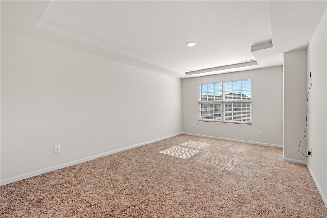452 Bee Cv Way Pendleton, SC 29670 - Photo 21 of 37 This spacious room features neutral carpet and a tray ceiling, ready for your personal touch.