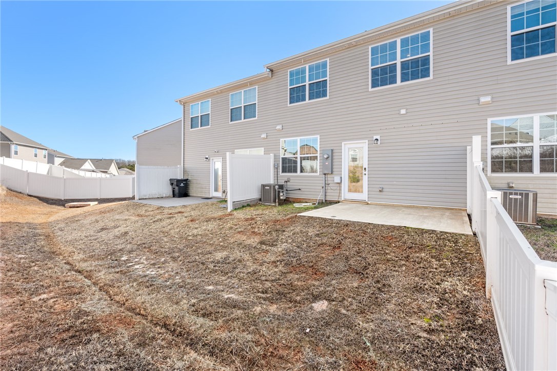 452 Bee Cv Way Pendleton, SC 29670 - Photo 30 of 37 This spacious backyard offers a patio for outdoor enjoyment, perfect for entertaining or quiet relaxation.