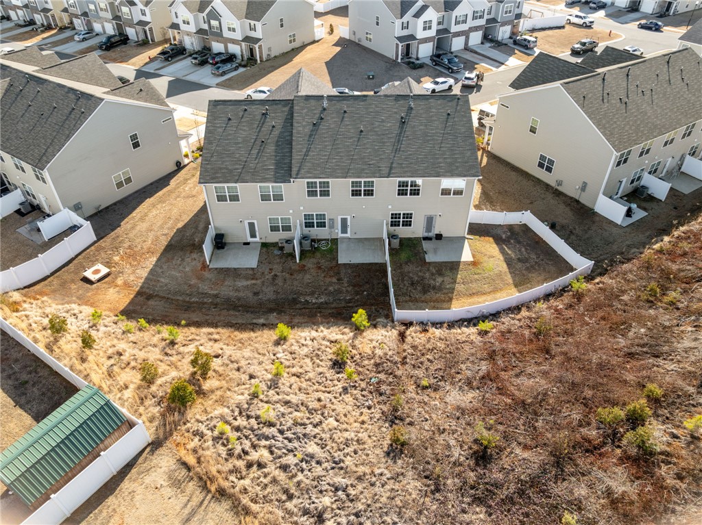 452 Bee Cv Way Pendleton, SC 29670 - Photo 34 of 37 This aerial view showcases a residential community with well-maintained homes and private yard spaces.