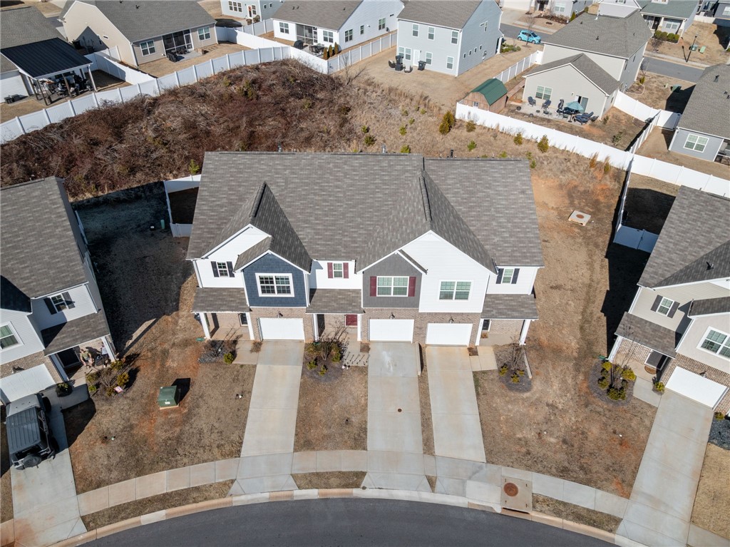 452 Bee Cv Way Pendleton, SC 29670 - Photo 35 of 37 This aerial perspective showcases a vibrant community of homes, each with individual garages and ample green spaces.