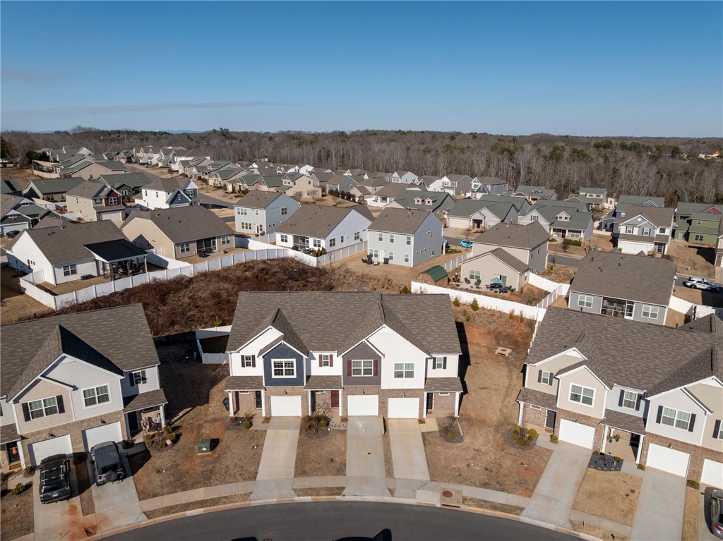 452 Bee Cv Way Pendleton, SC 29670 - Photo 36 of 37 An aerial view showcases a residential community with diverse homes and natural surroundings.