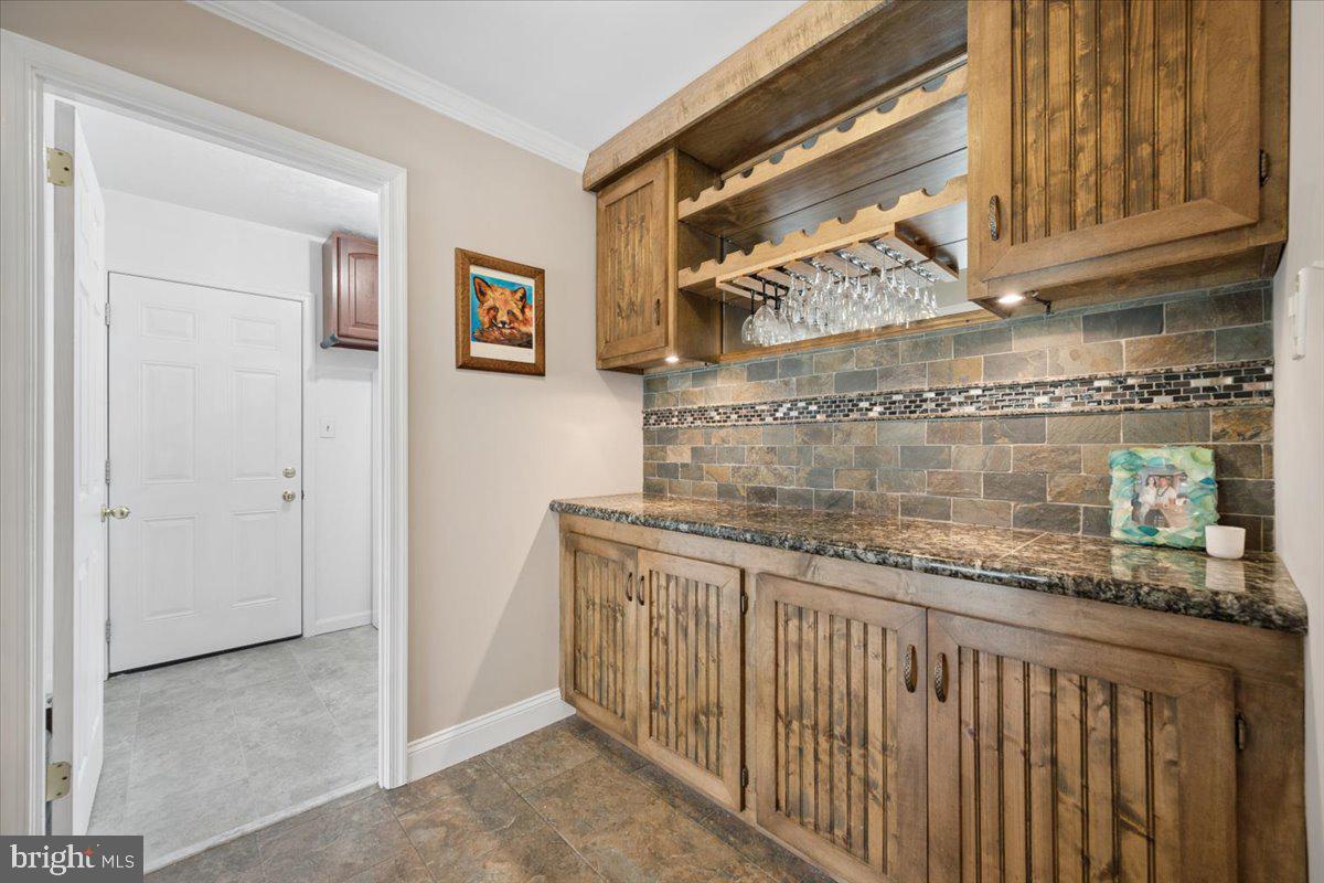 19829 Spurrier Avenue Poolesville, MD 20837 - Photo 30 of 72 Charming wet bar with rustic elegance.