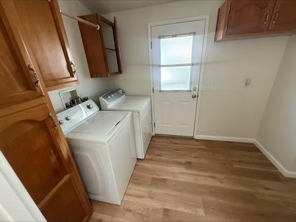 a view of storage and utility room with washer and dryer