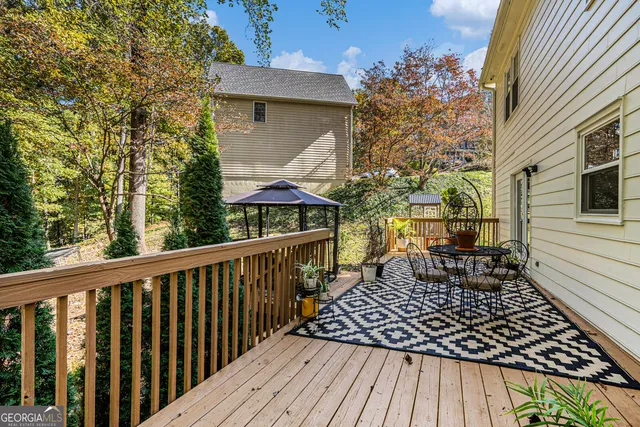 a view of a wooden deck with a table and chairs