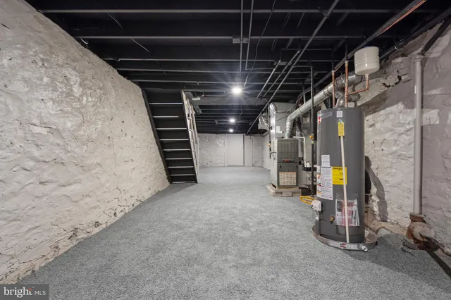 a view of empty room with wooden wall