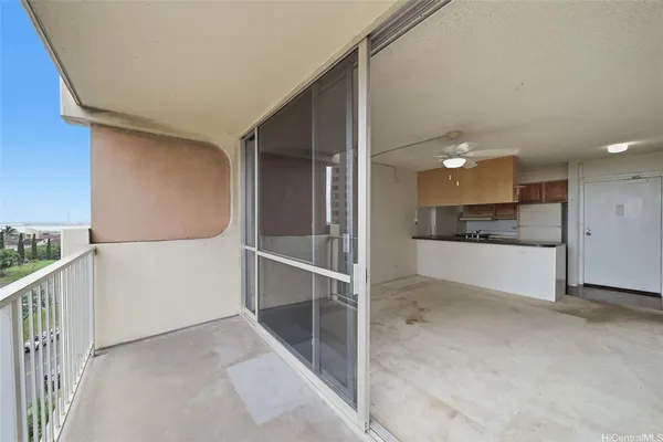 a view of a kitchen with a sink and refrigerator