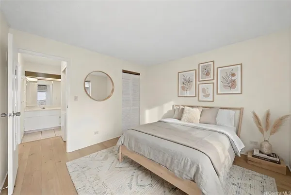 a bed room with a bed mirror and a window
