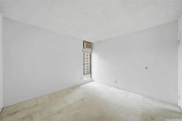 a view of an empty room and window