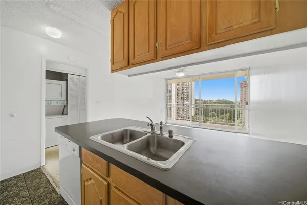 a kitchen with a sink and cabinets