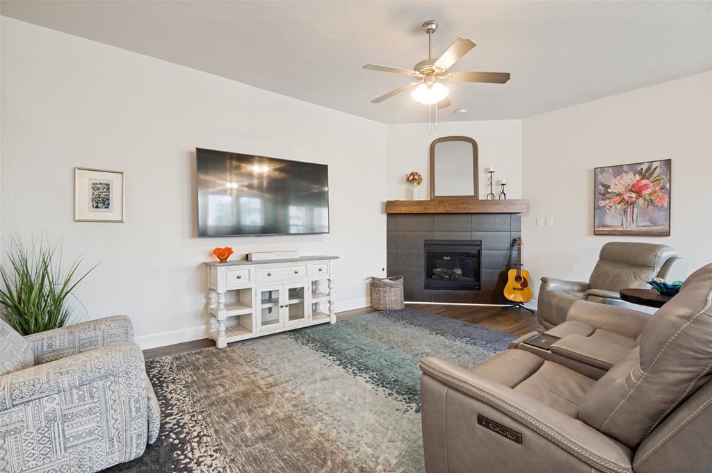 4724 Raspberry Spar Court Arlington, TX 76005 - Photo 11 of 40 a living room with furniture and a flat screen tv