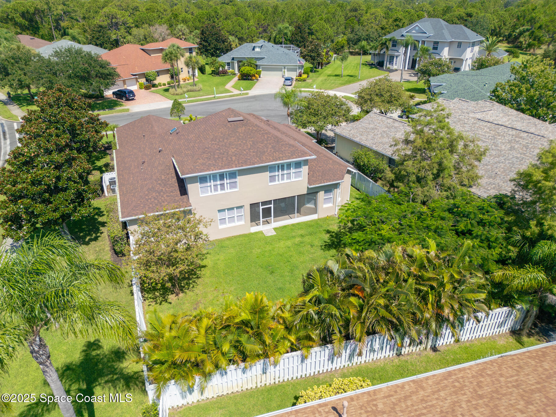 1007 Dowitcher Court Rockledge, FL 32955 - Photo 87 of 106 an aerial view of multiple houses with yard
