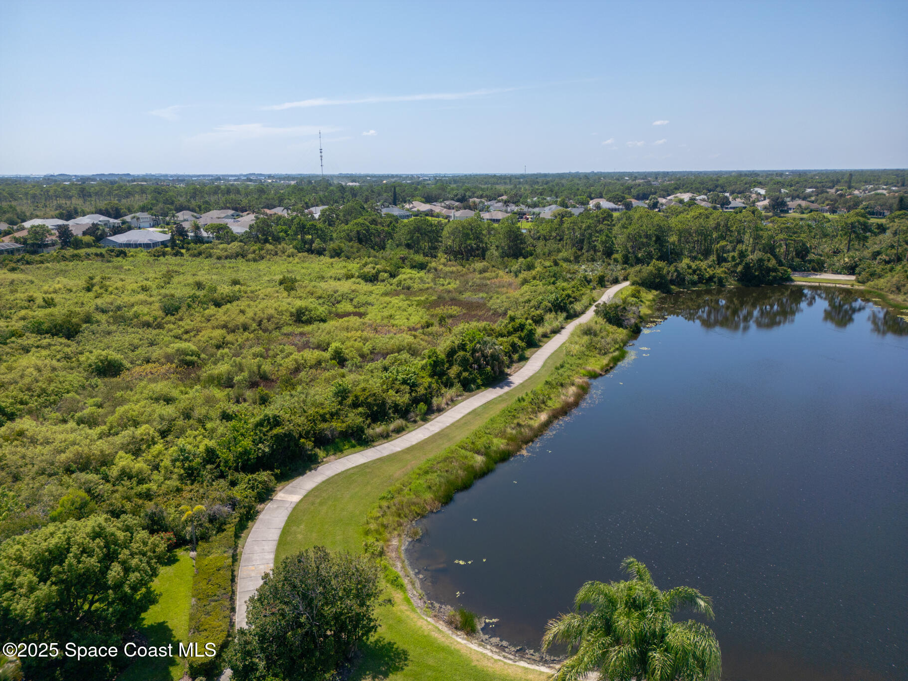 1007 Dowitcher Court Rockledge, FL 32955 - Photo 90 of 106 a view of a lake with a city