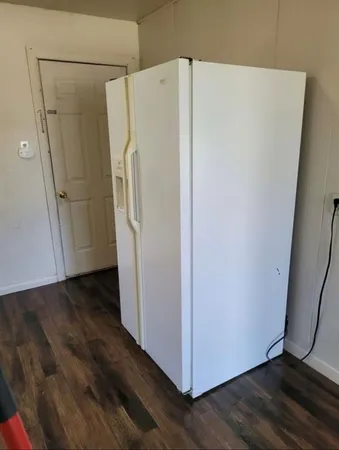 a white refrigerator freezer sitting in a kitchen