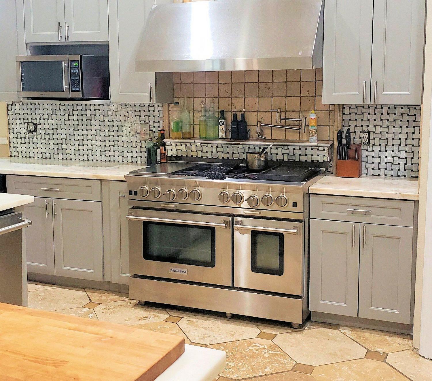 2529 Maine Avenue Clovis, CA 93619 - Photo 3 of 11 a kitchen with a stove and cabinets