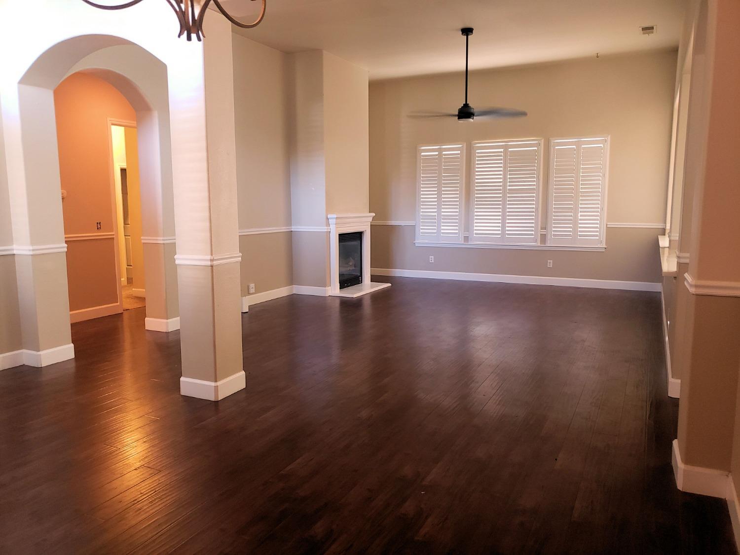 2529 Maine Avenue Clovis, CA 93619 - Photo 7 of 11 a view of empty room with wooden floor and fan
