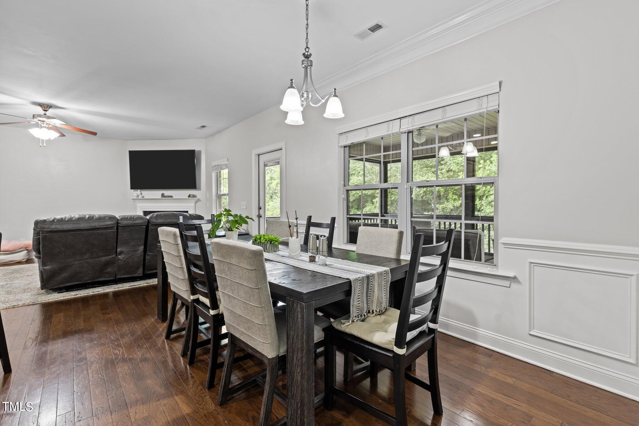 417 Bryerstone Drive Willow Spring, NC 27592 - Photo 15 of 43 a view of a dining room with furniture window and wooden floor