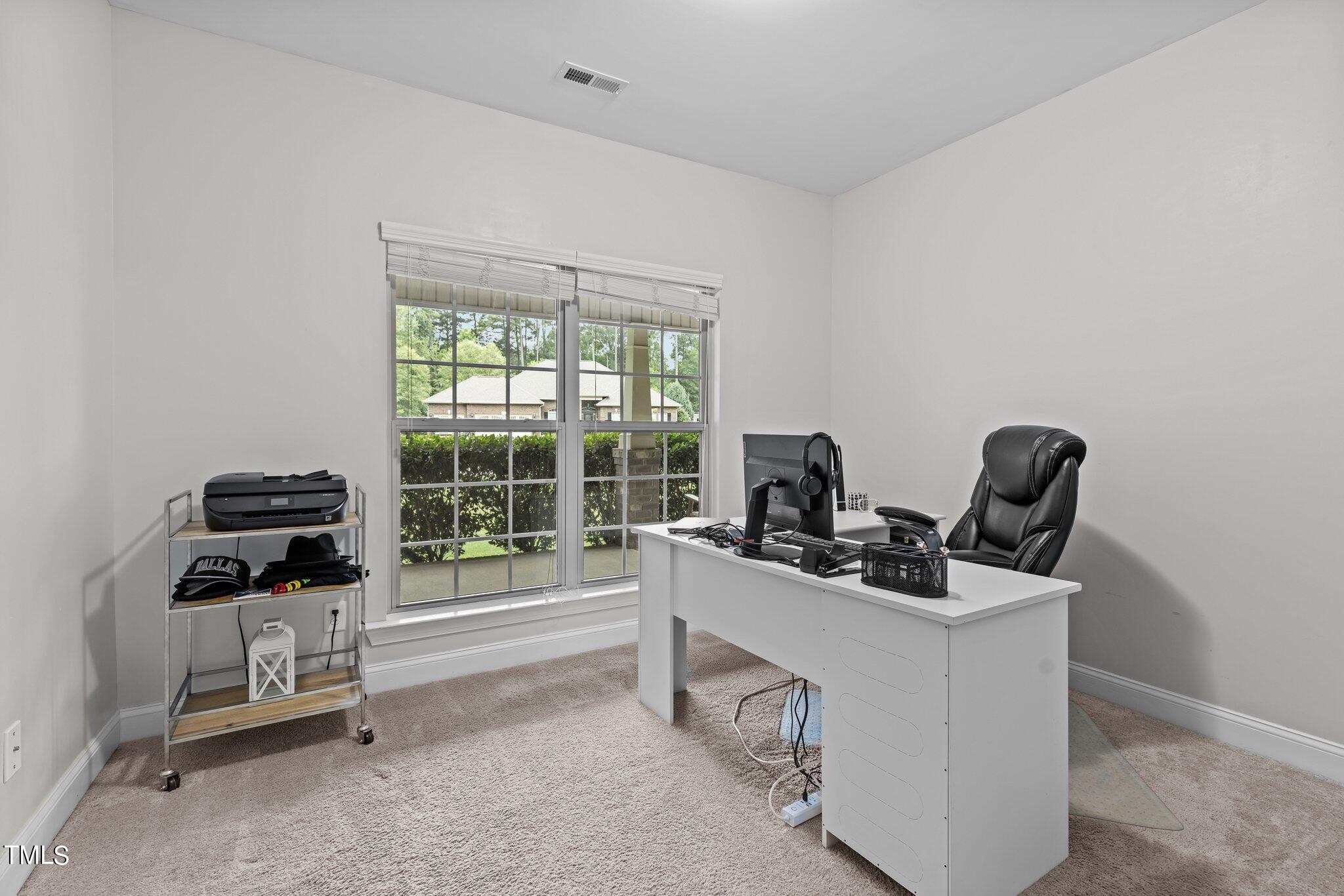 417 Bryerstone Drive Willow Spring, NC 27592 - Photo 17 of 43 a work room with furniture and windows