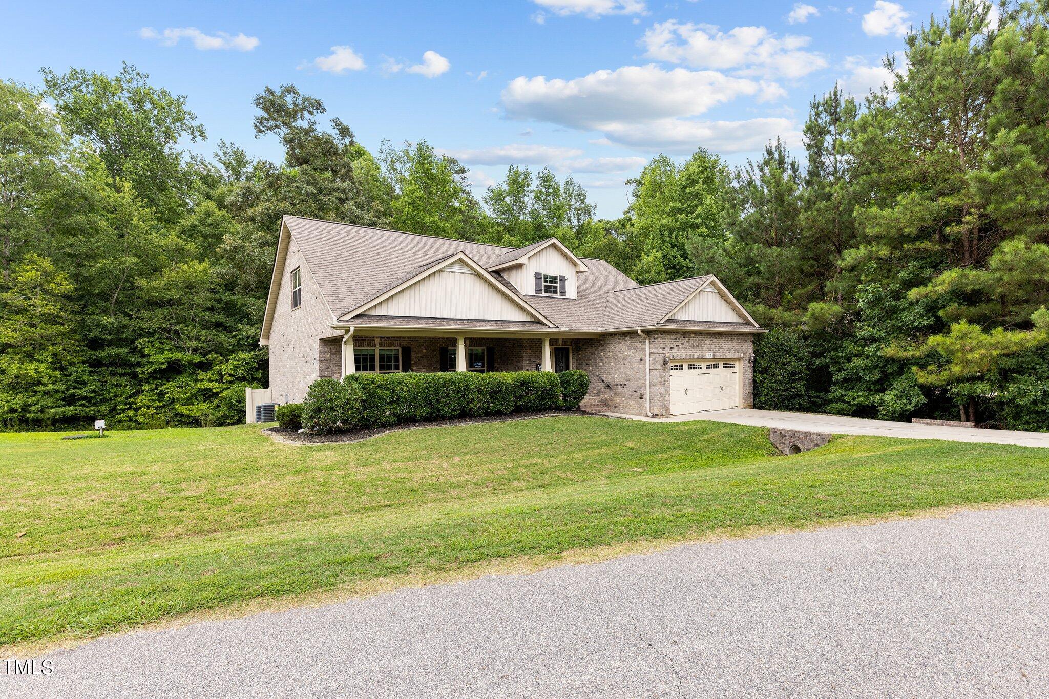 417 Bryerstone Drive Willow Spring, NC 27592 - Photo 2 of 43 a front view of a house with a yard