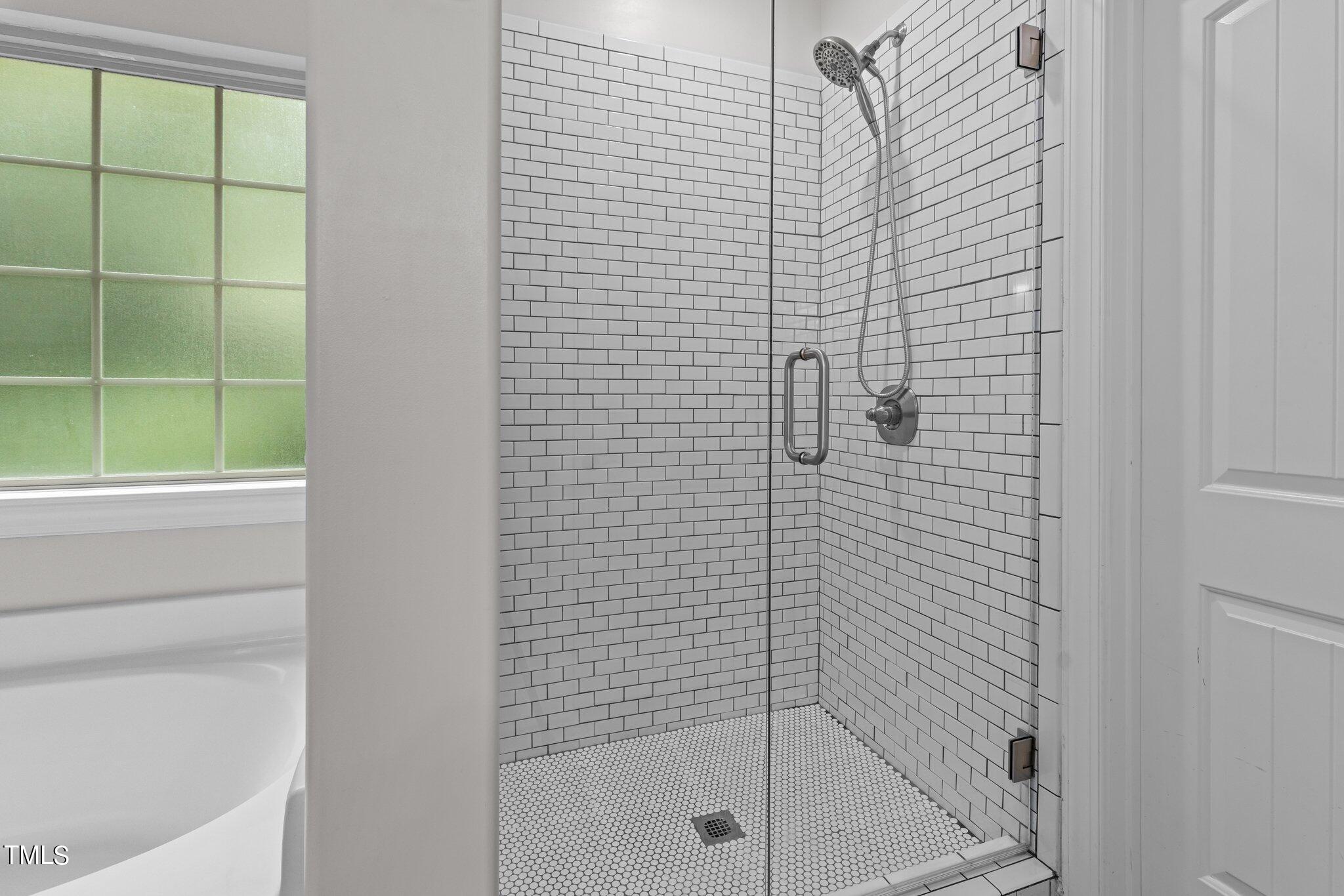 417 Bryerstone Drive Willow Spring, NC 27592 - Photo 22 of 43 a bathroom with a shower