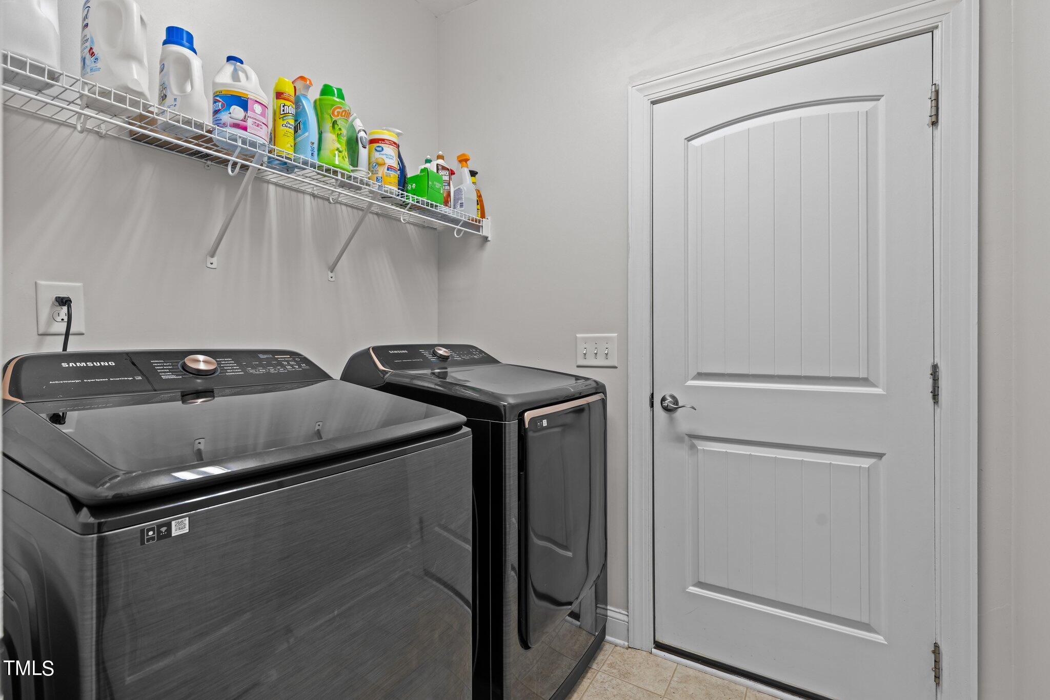 417 Bryerstone Drive Willow Spring, NC 27592 - Photo 30 of 43 a utility room with dryer and washer