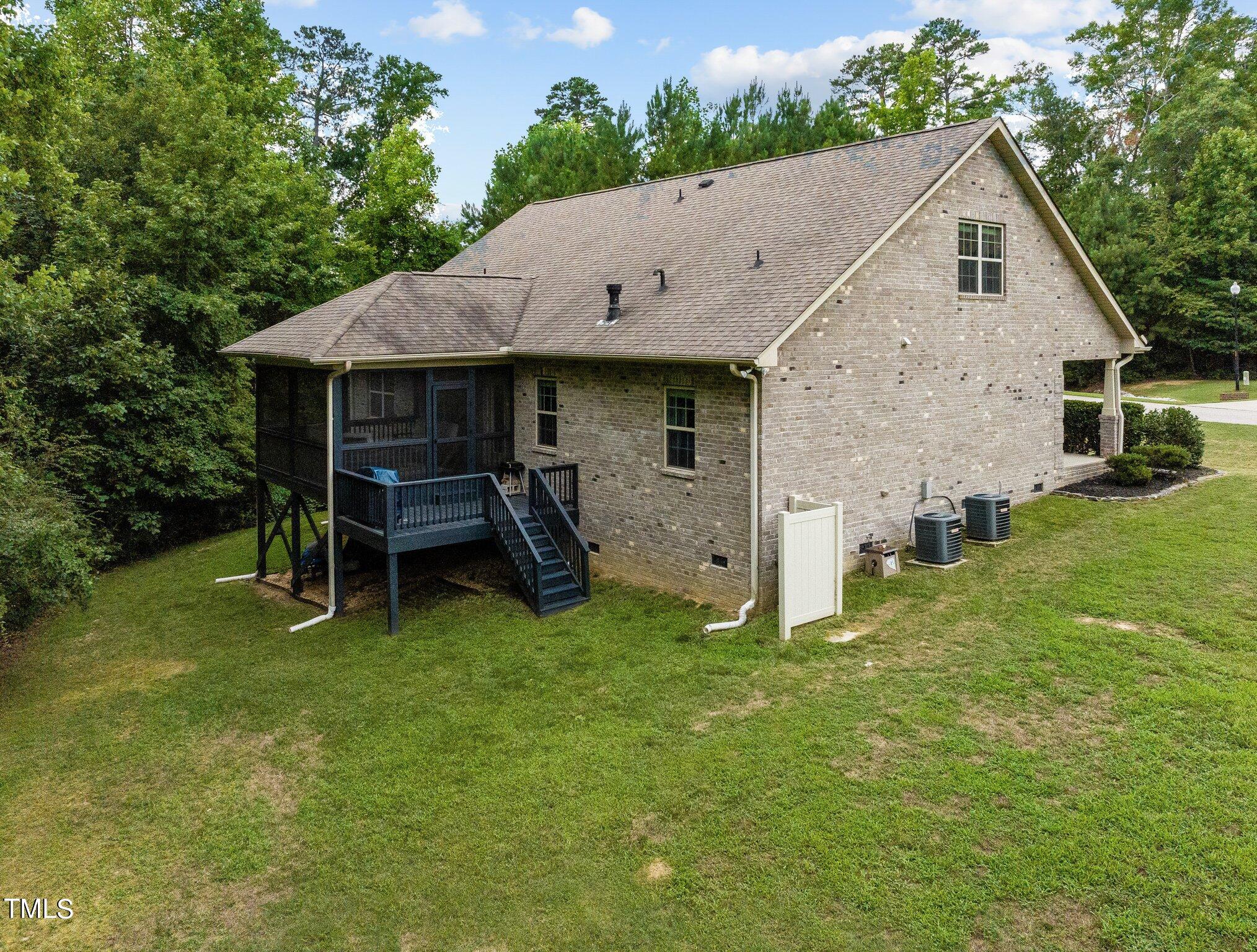417 Bryerstone Drive Willow Spring, NC 27592 - Photo 33 of 43 a view of a house with a yard and sitting area