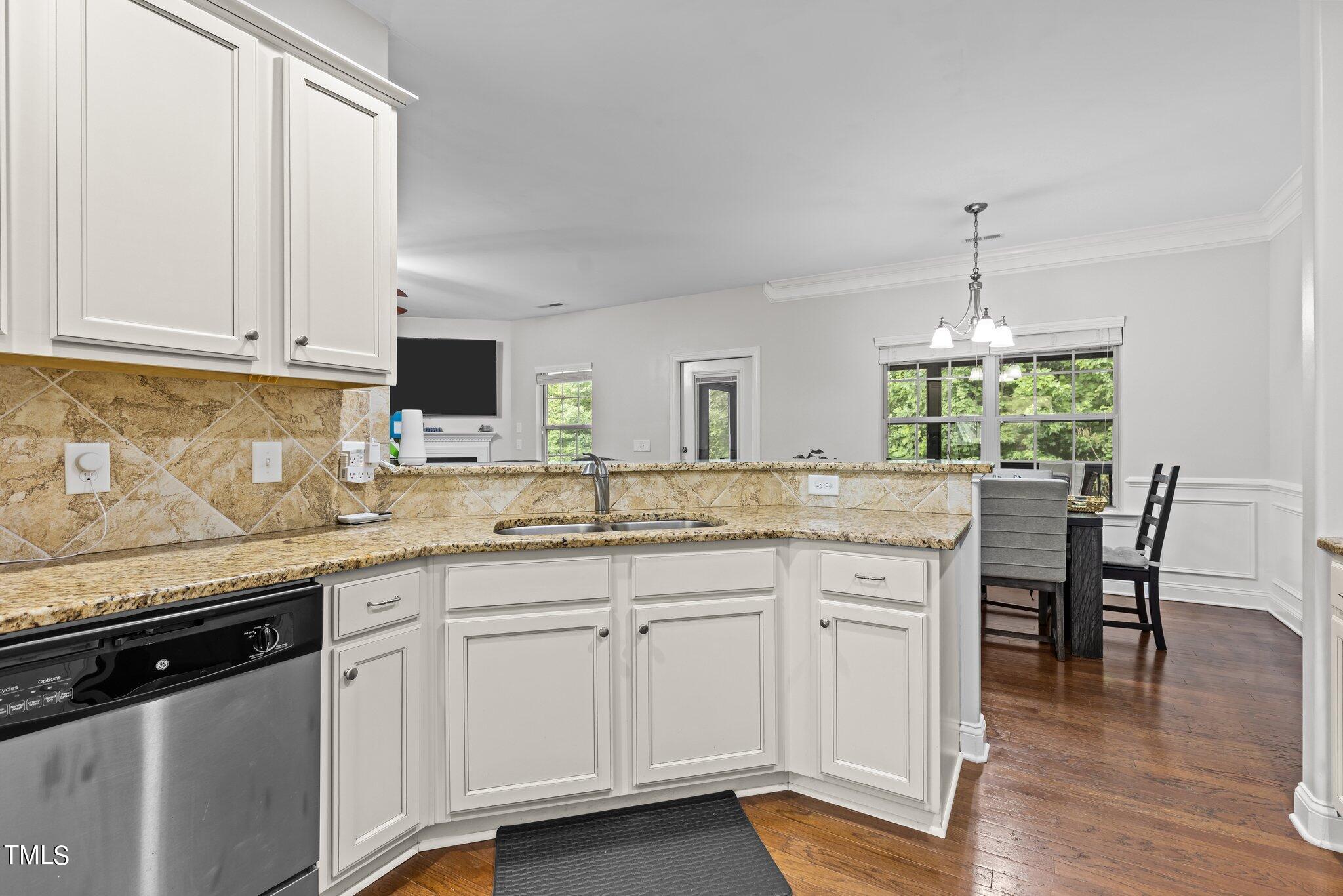 417 Bryerstone Drive Willow Spring, NC 27592 - Photo 6 of 43 a kitchen with white cabinets and sink