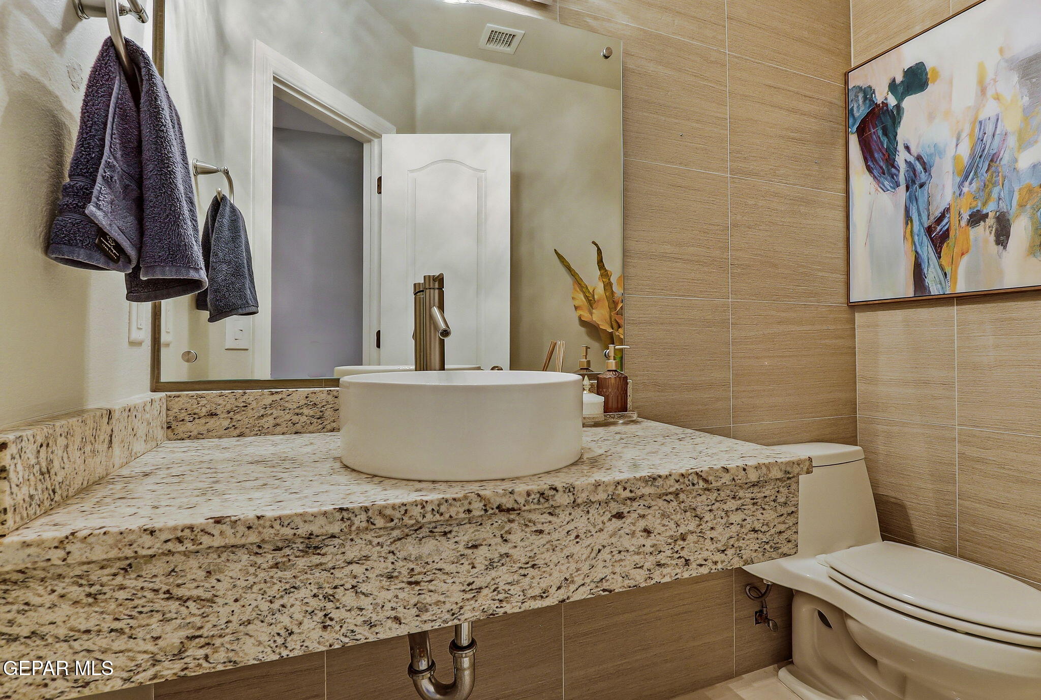 1297 Cypress Ridge Drive El Paso, TX 79912 - Photo 14 of 77 a bathroom with a granite countertop sink and a toilet
