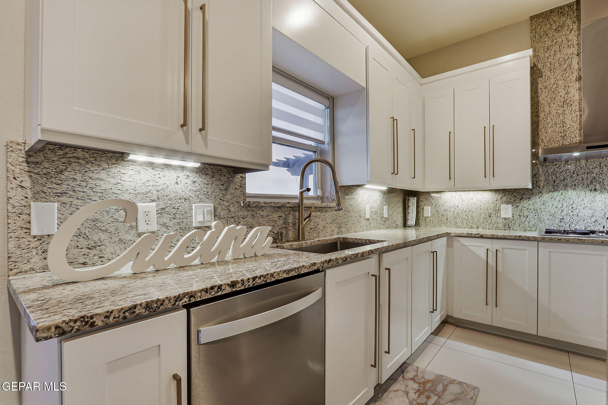 1297 Cypress Ridge Drive El Paso, TX 79912 - Photo 23 of 77 a kitchen with granite countertop white cabinets and sink