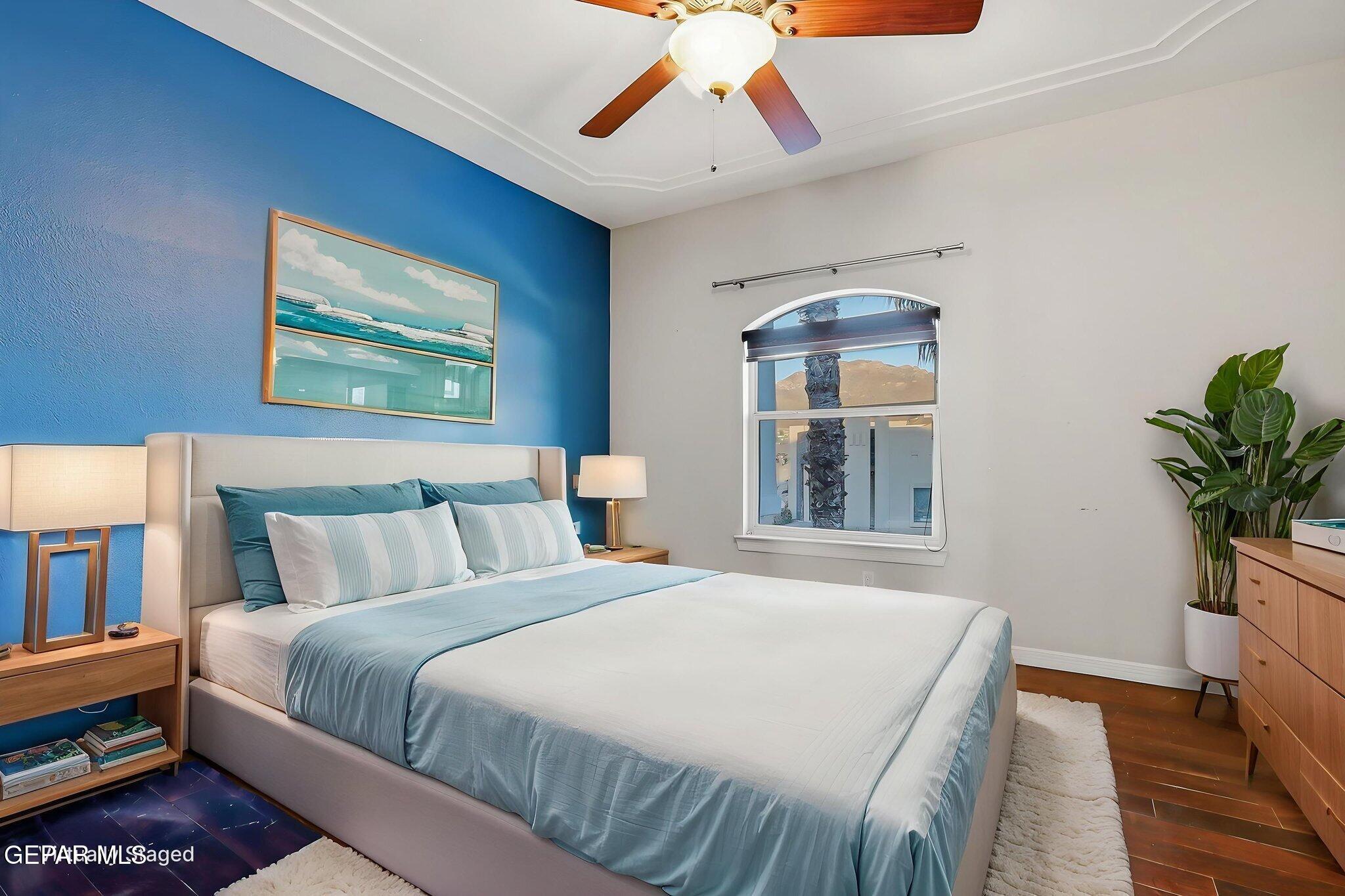 1297 Cypress Ridge Drive El Paso, TX 79912 - Photo 40 of 77 a bedroom with a bed and a potted plant