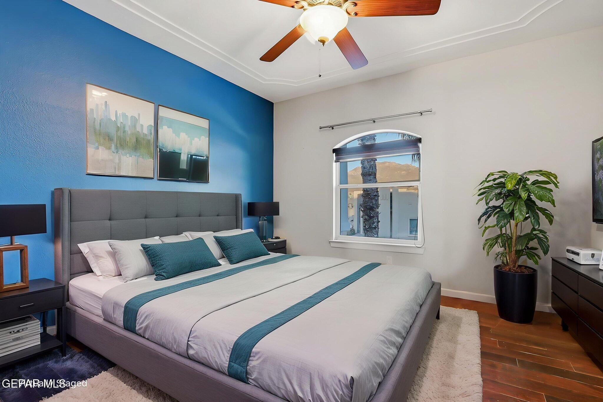 1297 Cypress Ridge Drive El Paso, TX 79912 - Photo 42 of 77 a bedroom with bed and a potted plant