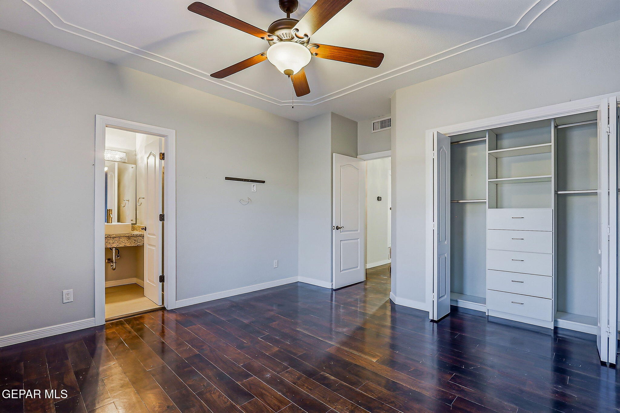 1297 Cypress Ridge Drive El Paso, TX 79912 - Photo 43 of 77 an empty room with wooden floor closet and windows