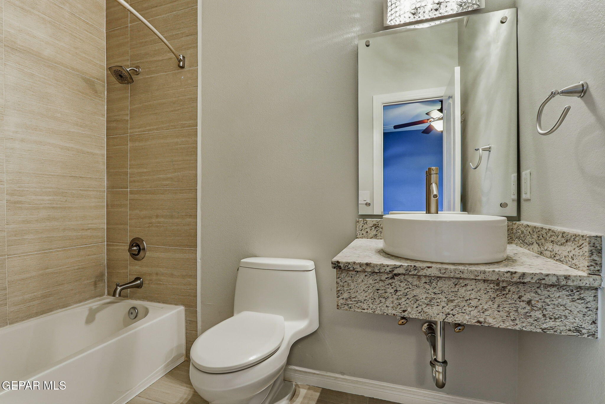 1297 Cypress Ridge Drive El Paso, TX 79912 - Photo 44 of 77 a bathroom with a granite countertop sink toilet and shower