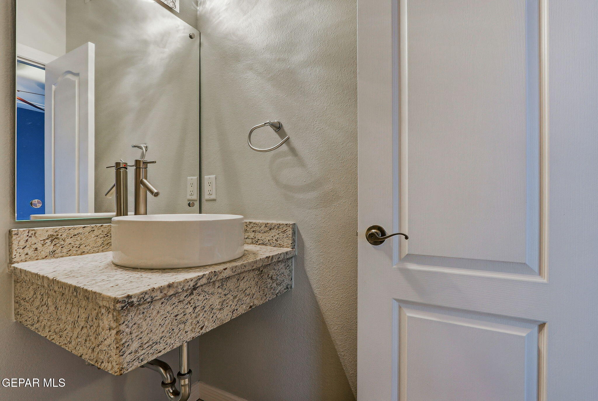 1297 Cypress Ridge Drive El Paso, TX 79912 - Photo 45 of 77 a bathroom with a granite countertop sink and a mirror