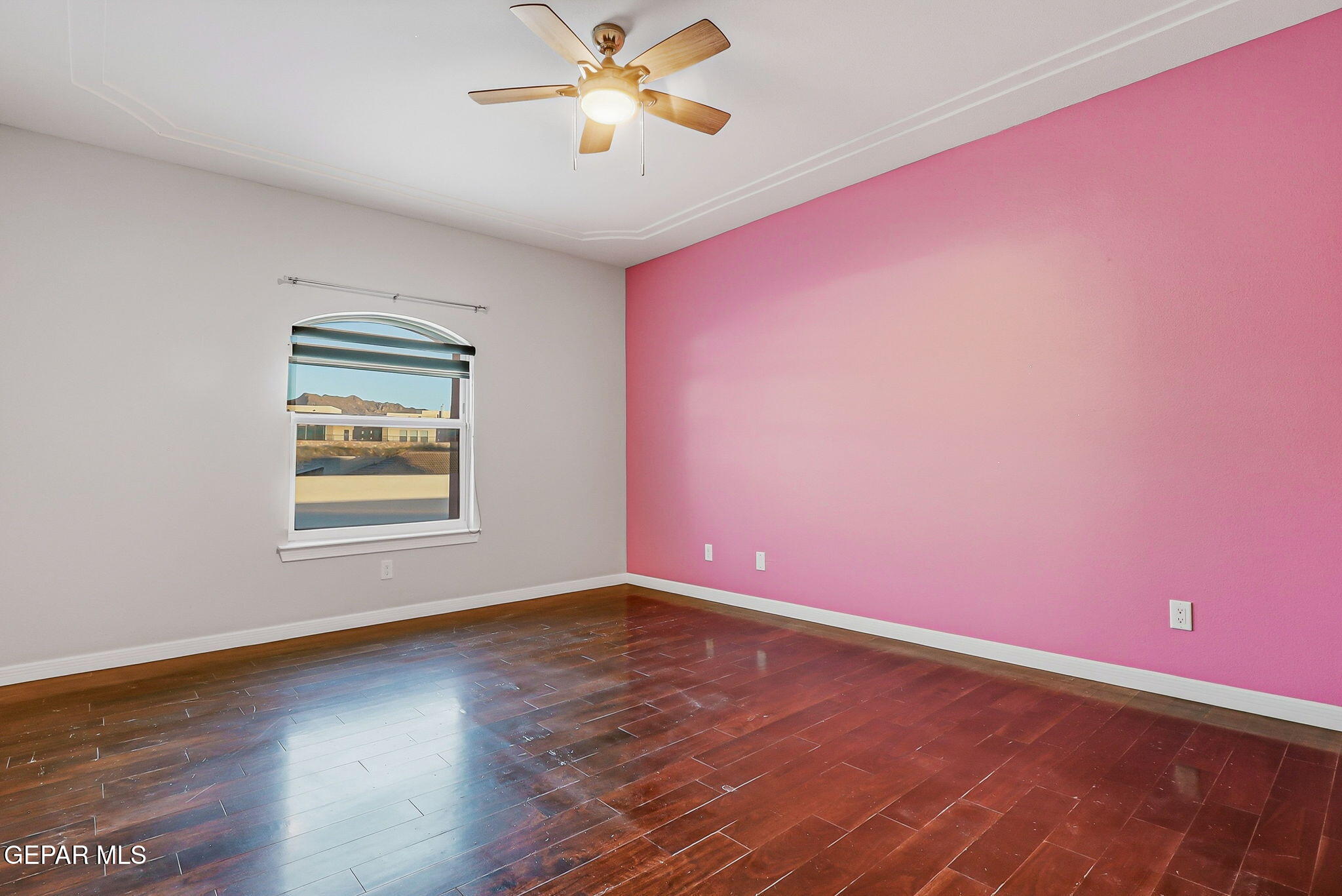 1297 Cypress Ridge Drive El Paso, TX 79912 - Photo 47 of 77 a view of empty room with wooden floor and fan