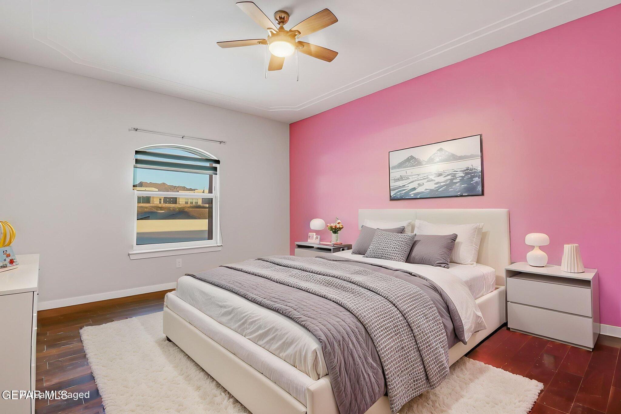 1297 Cypress Ridge Drive El Paso, TX 79912 - Photo 48 of 77 a bedroom with a bed and a chandelier