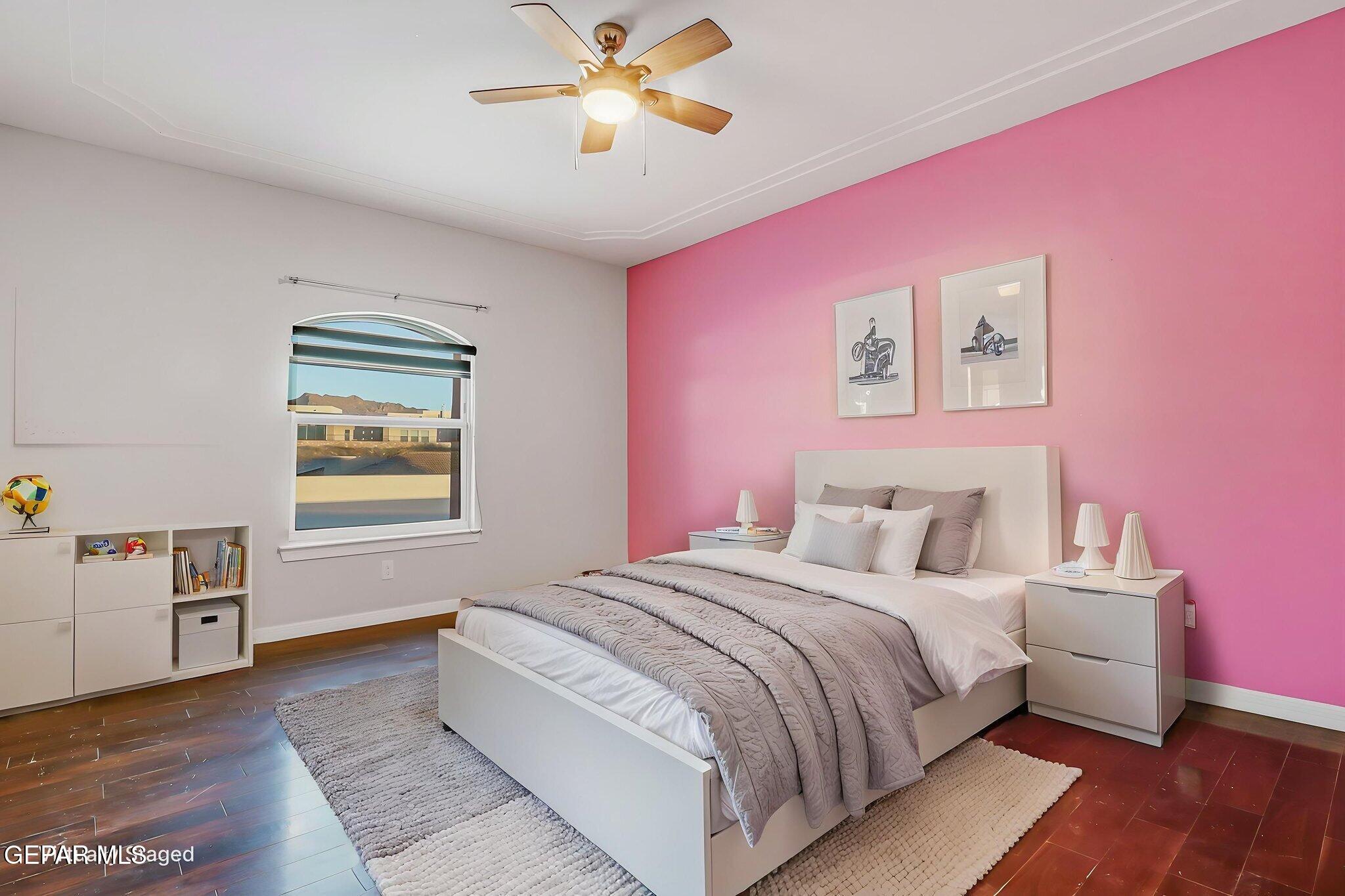 1297 Cypress Ridge Drive El Paso, TX 79912 - Photo 49 of 77 a bedroom with a bed and a chandelier