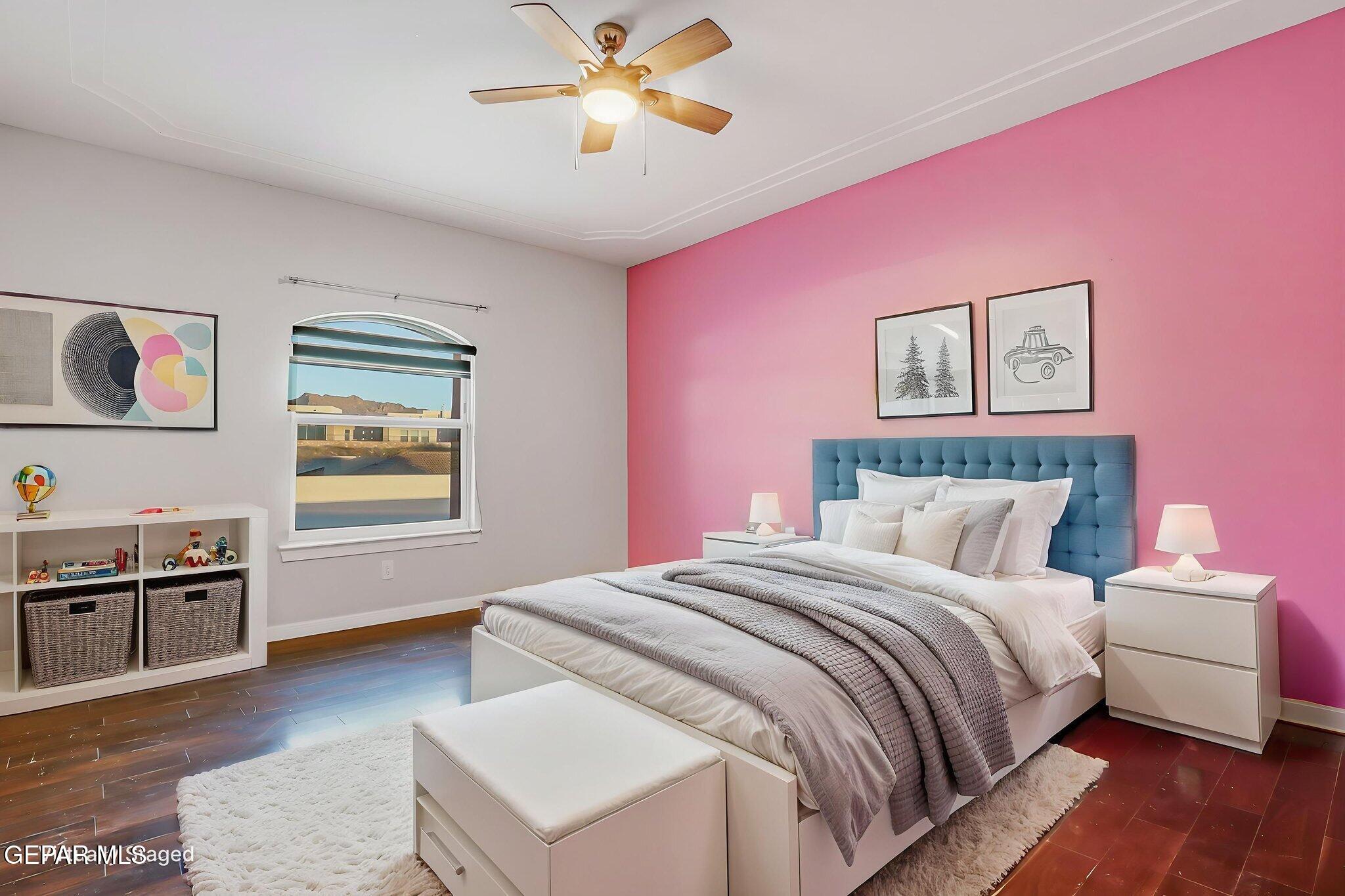 1297 Cypress Ridge Drive El Paso, TX 79912 - Photo 50 of 77 a bedroom with a bed and a chandelier