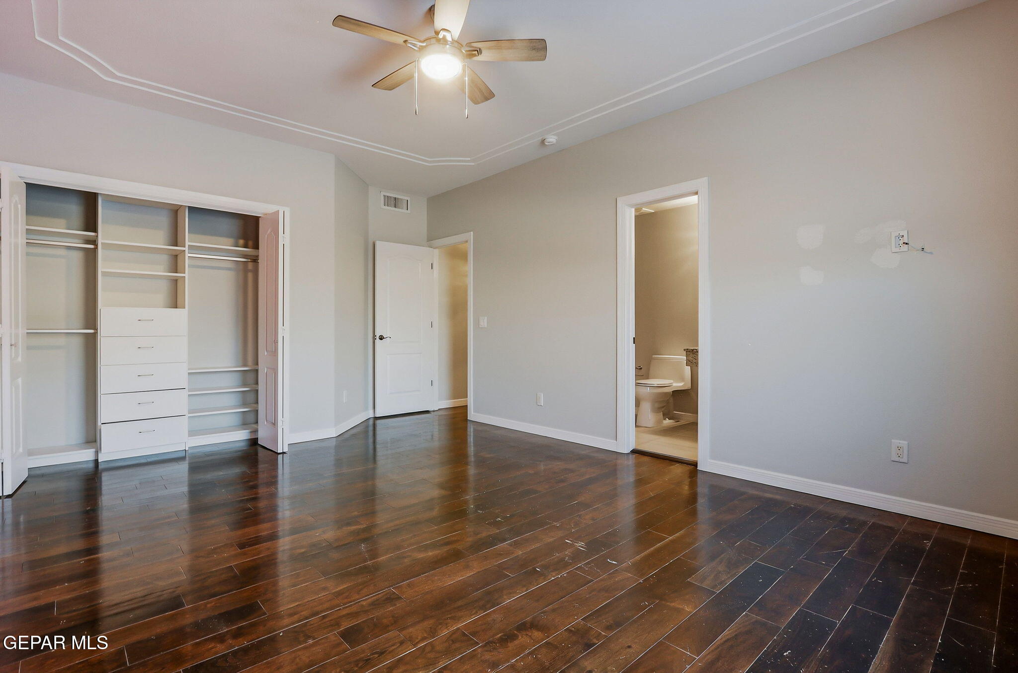 1297 Cypress Ridge Drive El Paso, TX 79912 - Photo 51 of 77 a view of an empty room with wooden floor