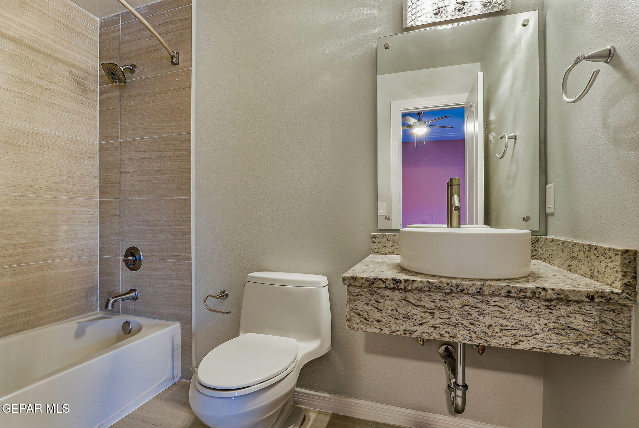 1297 Cypress Ridge Drive El Paso, TX 79912 - Photo 52 of 77 a bathroom with a granite countertop sink toilet and shower
