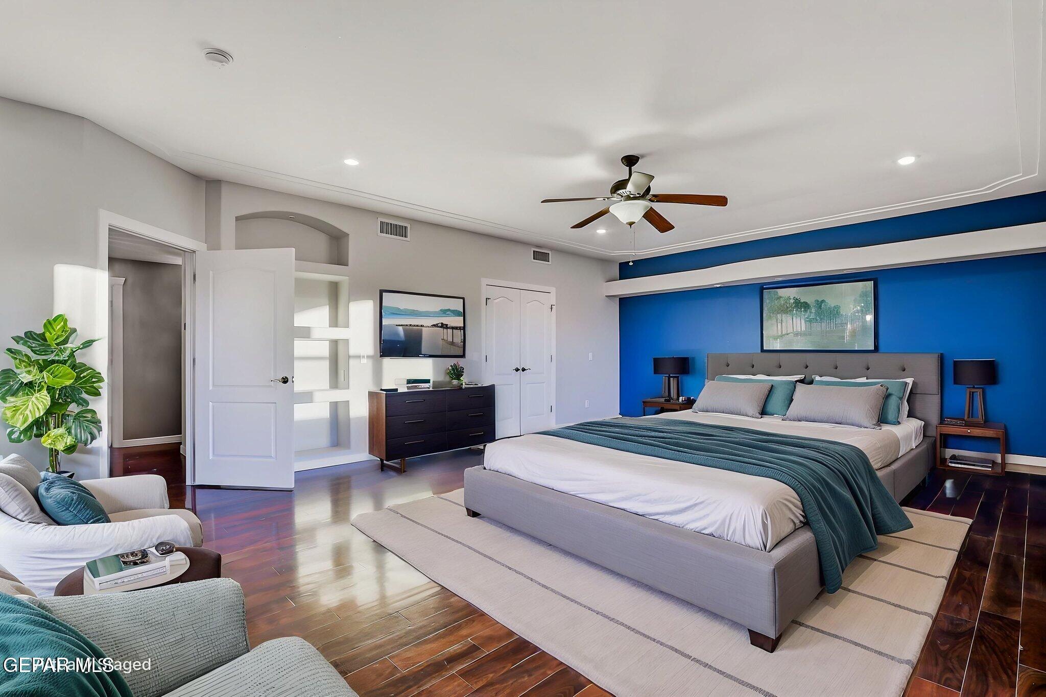 1297 Cypress Ridge Drive El Paso, TX 79912 - Photo 59 of 77 a spacious bedroom with a bed and furniture